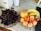 A bright kitchen counter displaying a colorful assortment of fresh fruits and vegetables in bowls.