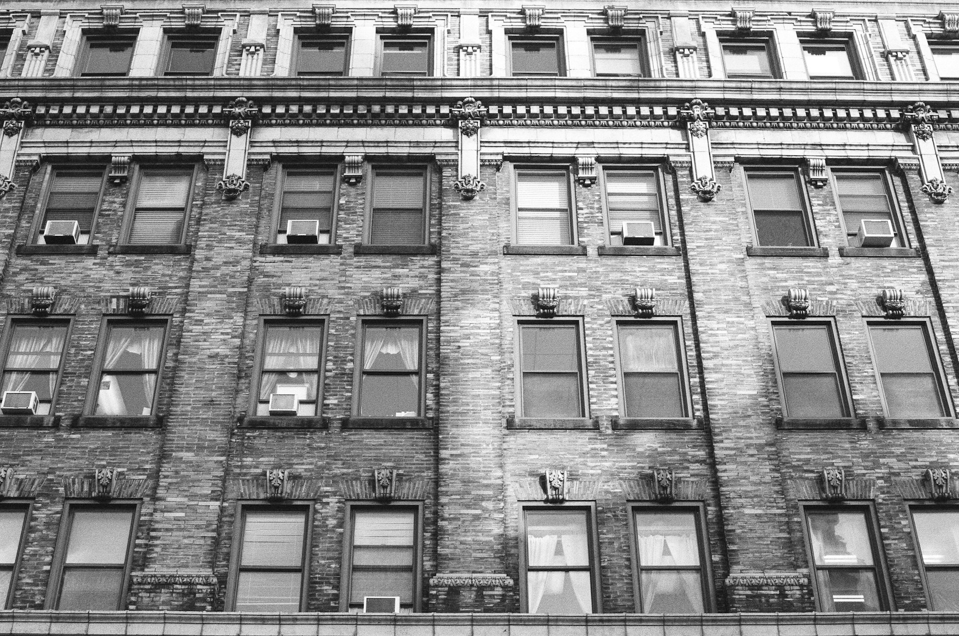 woman wearing yellow long-sleeved dress under white clouds and blue sky during daytime