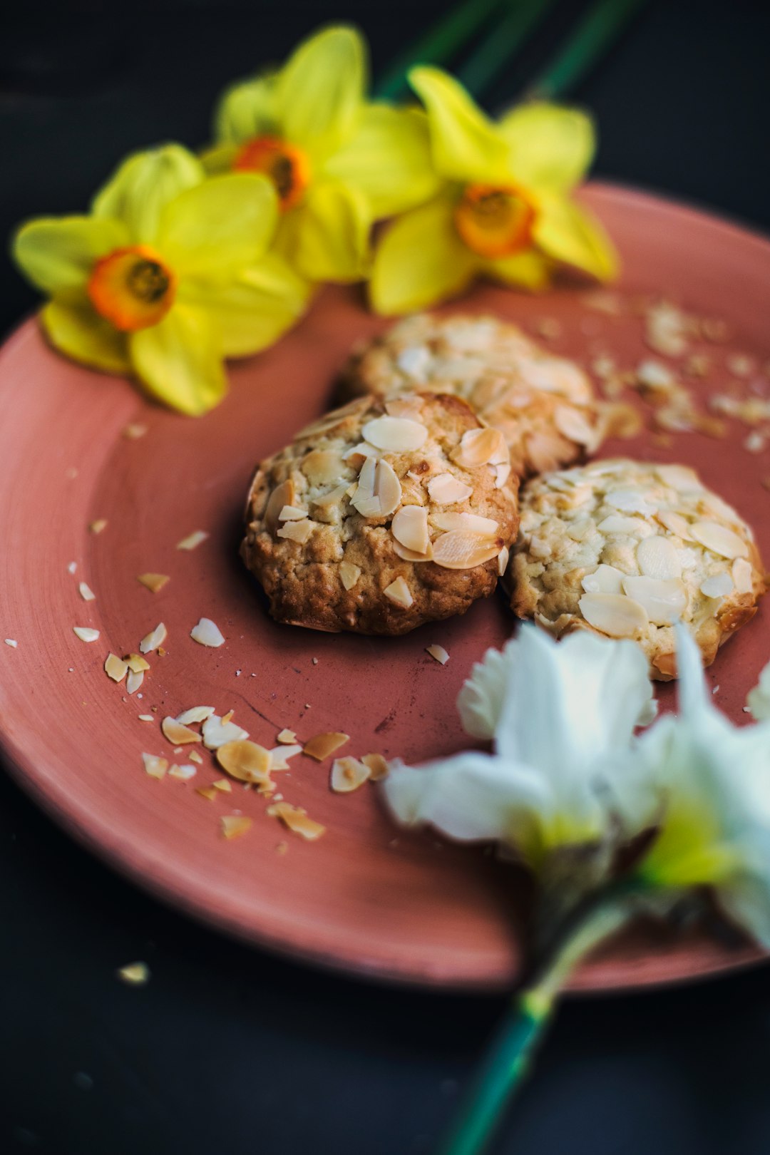 oatmeal cookies and daffodil flowers on plate