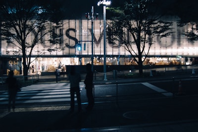 Nighttime shot of commercial building illuminated for a welcoming atmosphere