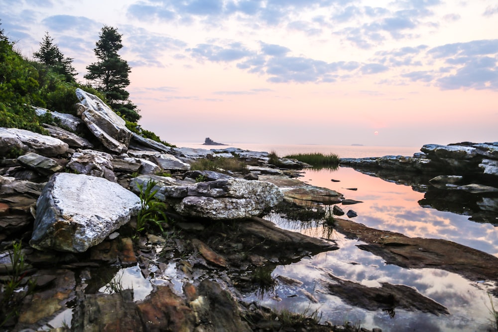 rock formation surrounded by water