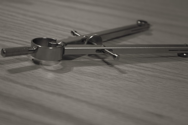A detailed image of a Masonic compass and square.