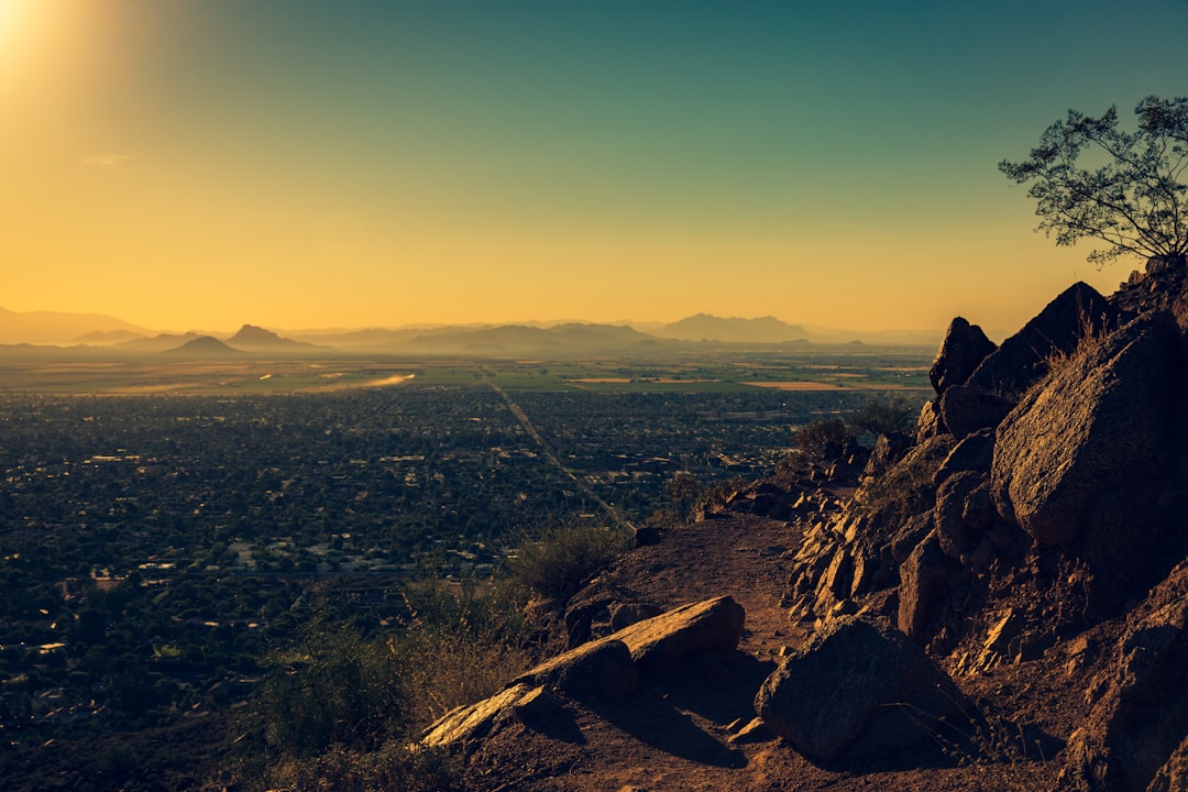 photo of city by rock formations