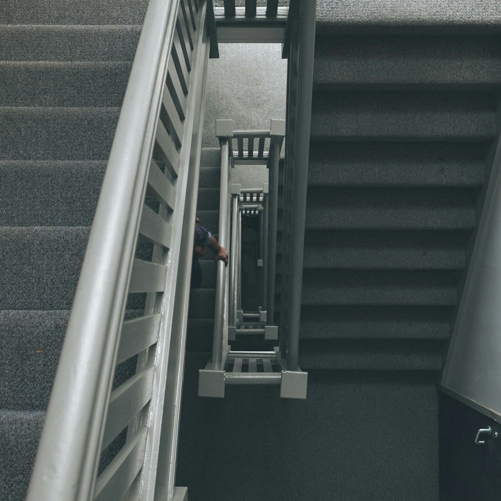 photo of grey staircase with grey metal railings