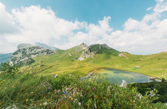 body of water on mountain in Valparola Pass Italy