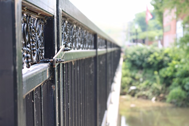 Close-up of a durable iron fence showing strong welds and a heat-resistant coating.