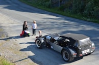 A family enjoying a day out with their beautifully detailed vehicle.