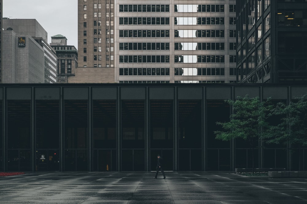 person walking near building during daytime