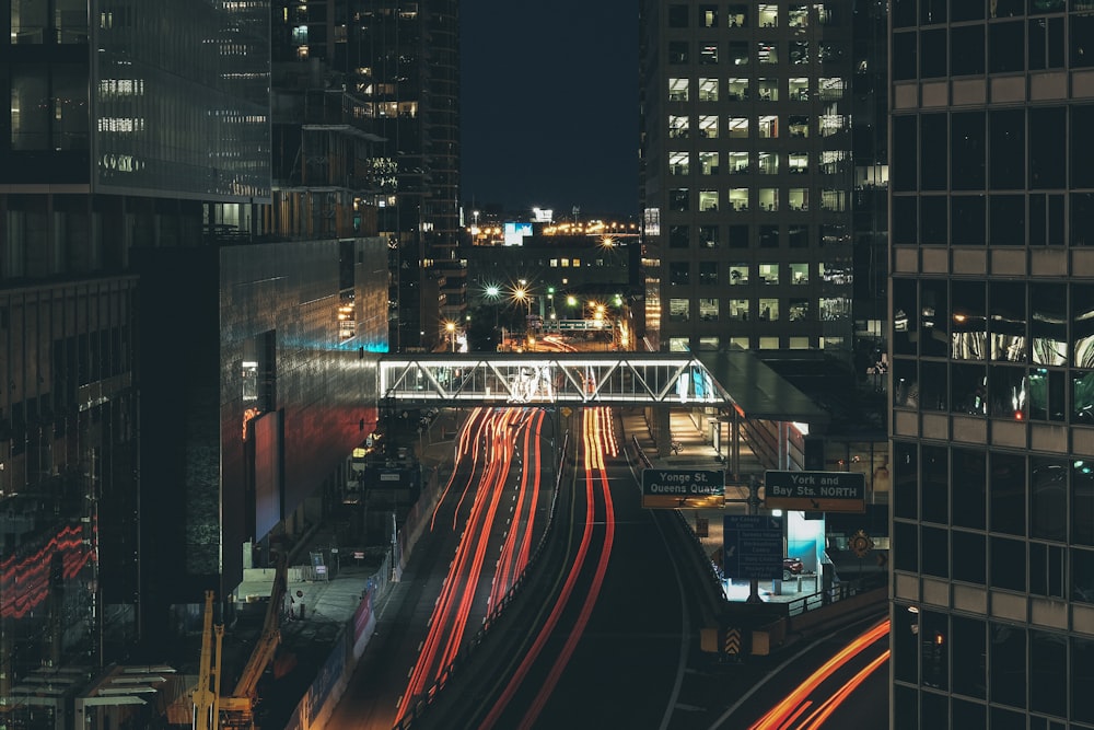 time lapse photo of vehicle on road during night time