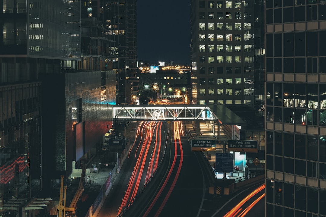 time lapse photo of vehicle on road during night time