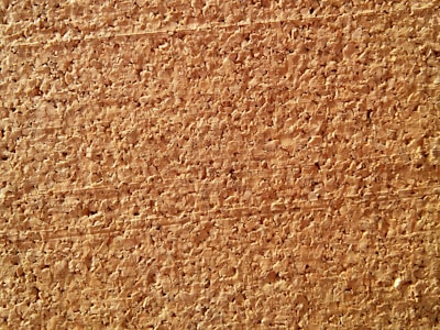Close-up of eco-friendly cork accessories displayed on a wooden surface.