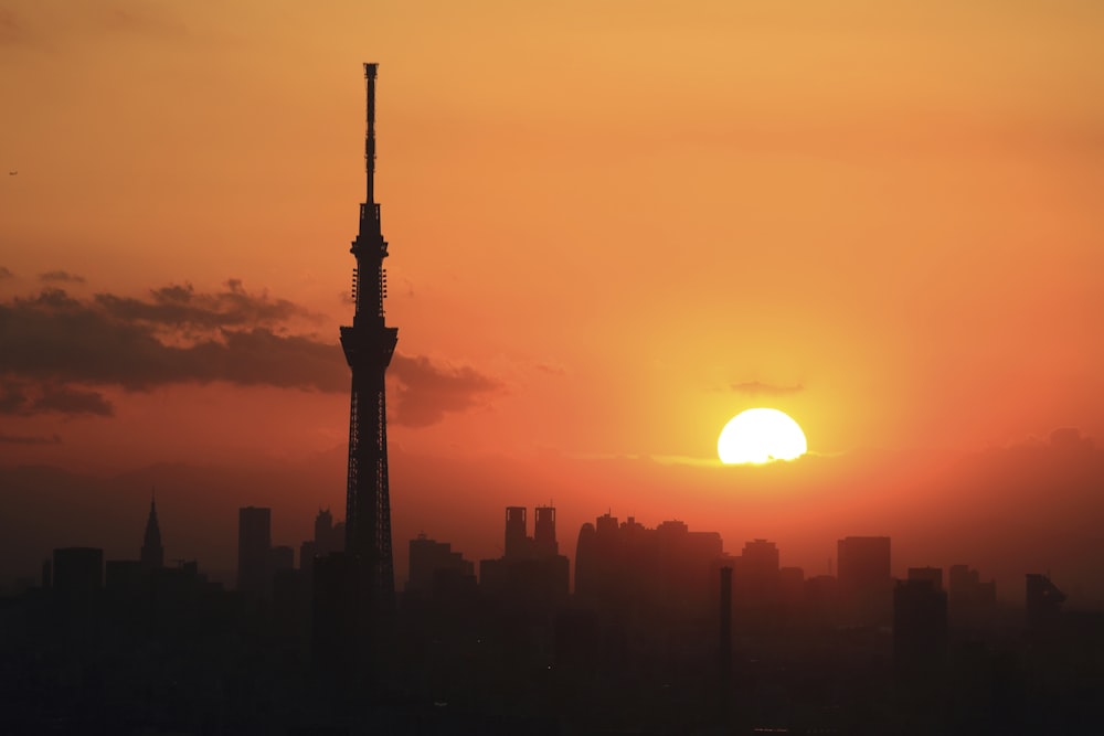 silhouette of high rise building during sunset