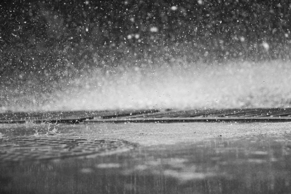 grayscale photo of raindrops