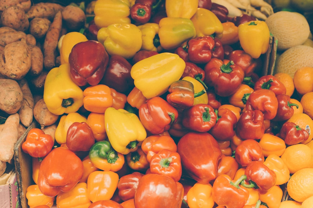 flat lay photography of bunch of yellow and red bell peppers