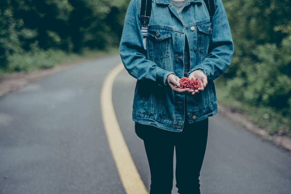 person standing on a road