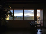 Writing desk by the window in standard room with a scenic view.