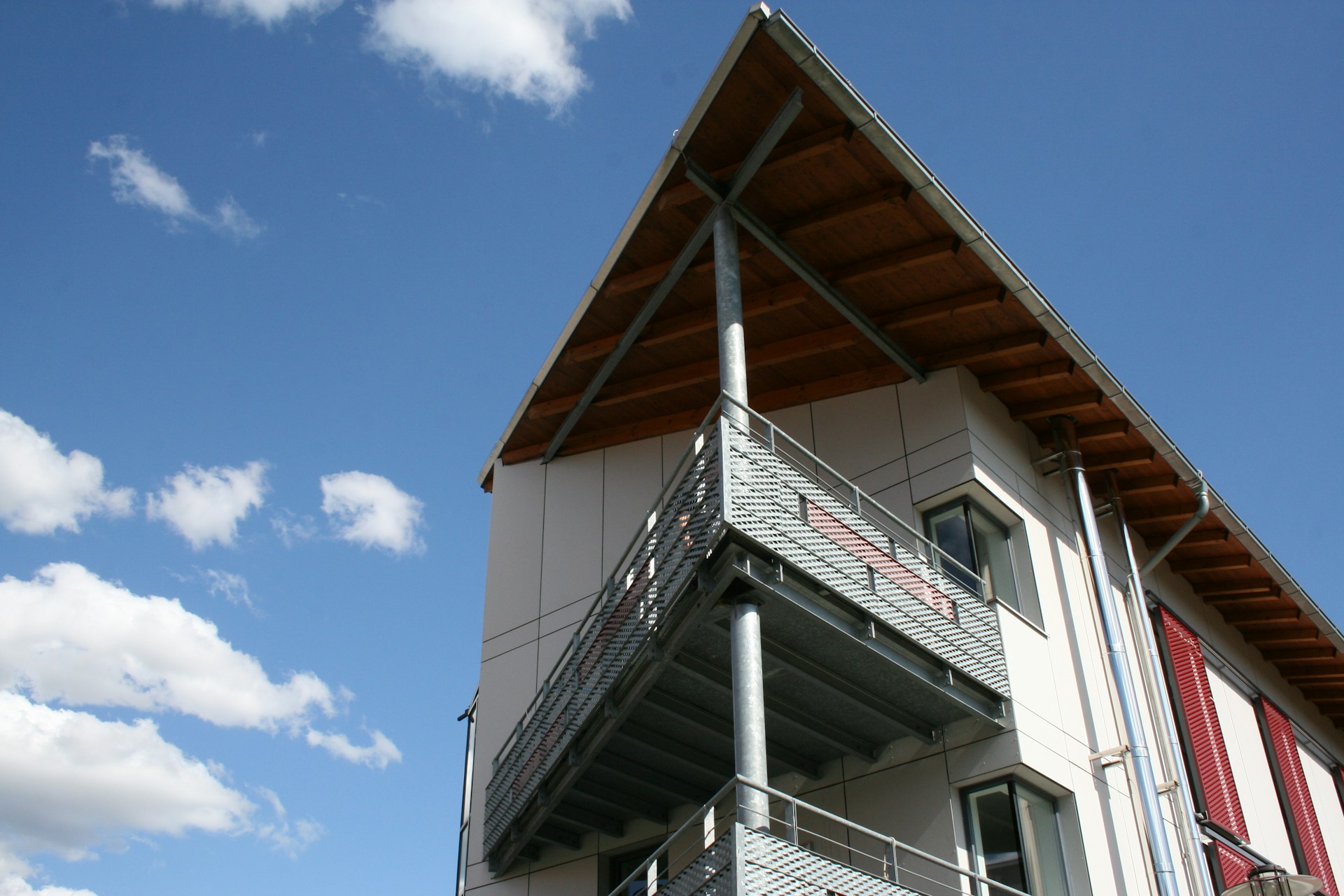 woman wearing yellow long-sleeved dress under white clouds and blue sky during daytime