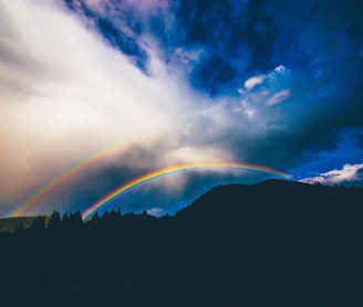 rainbow over mountain illustration