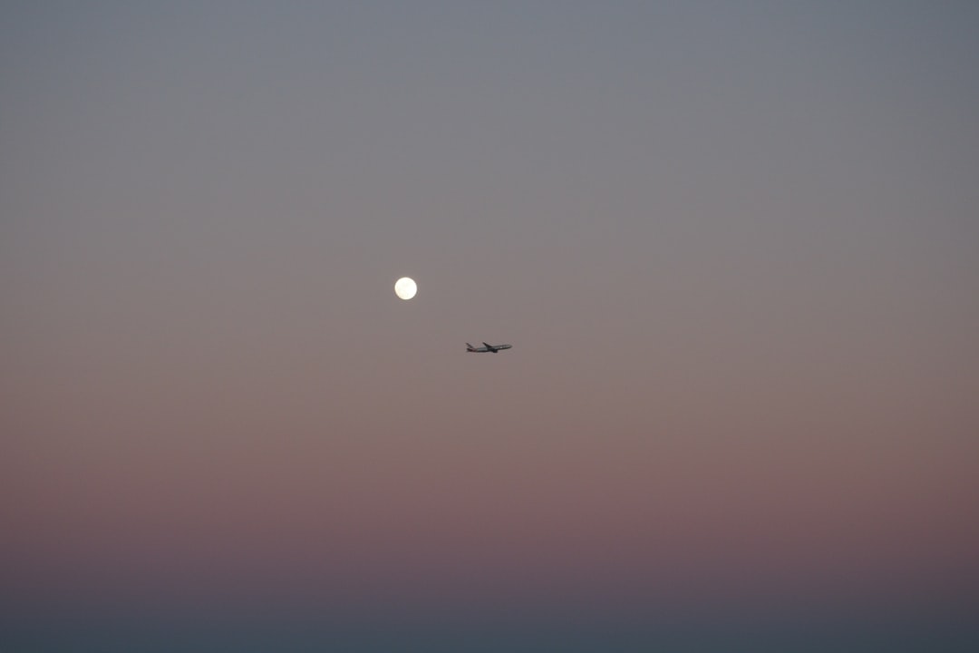 silhouette photo of plane on the sky, Airplane and moon on sky