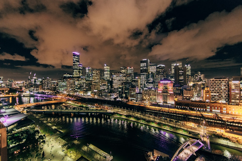 An urban panorama on the banks of a river in Melbourne at night