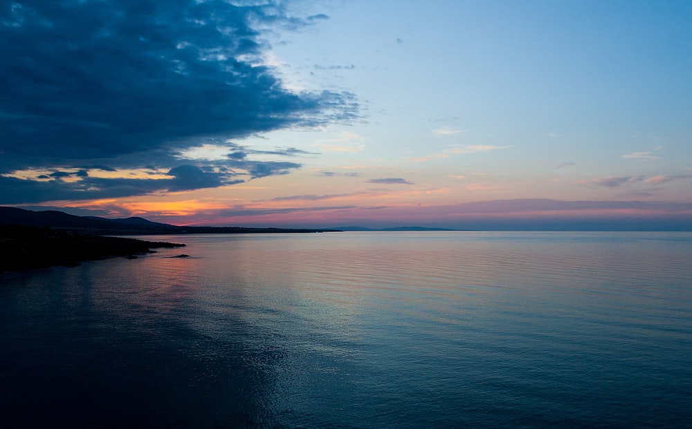 body of water during sunset landscape photography