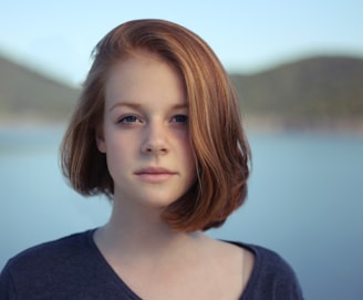 shallow focus photography of woman outdoor during day