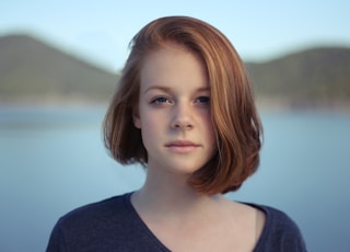 shallow focus photography of woman outdoor during day