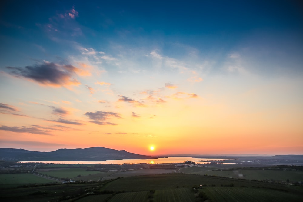 bird's-eye view photo of landscape field during golden hour