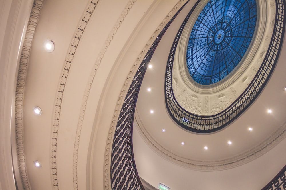 low-angle photo of white spiral building