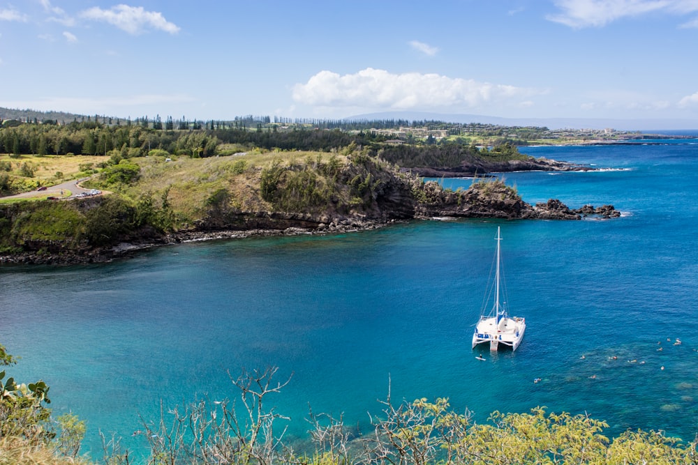 bird's eye view photography of sailing ship near shore