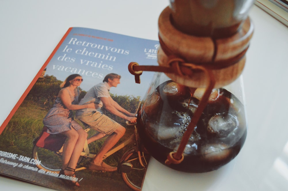 Retrouvons Ic Chemin book beside cork bottle