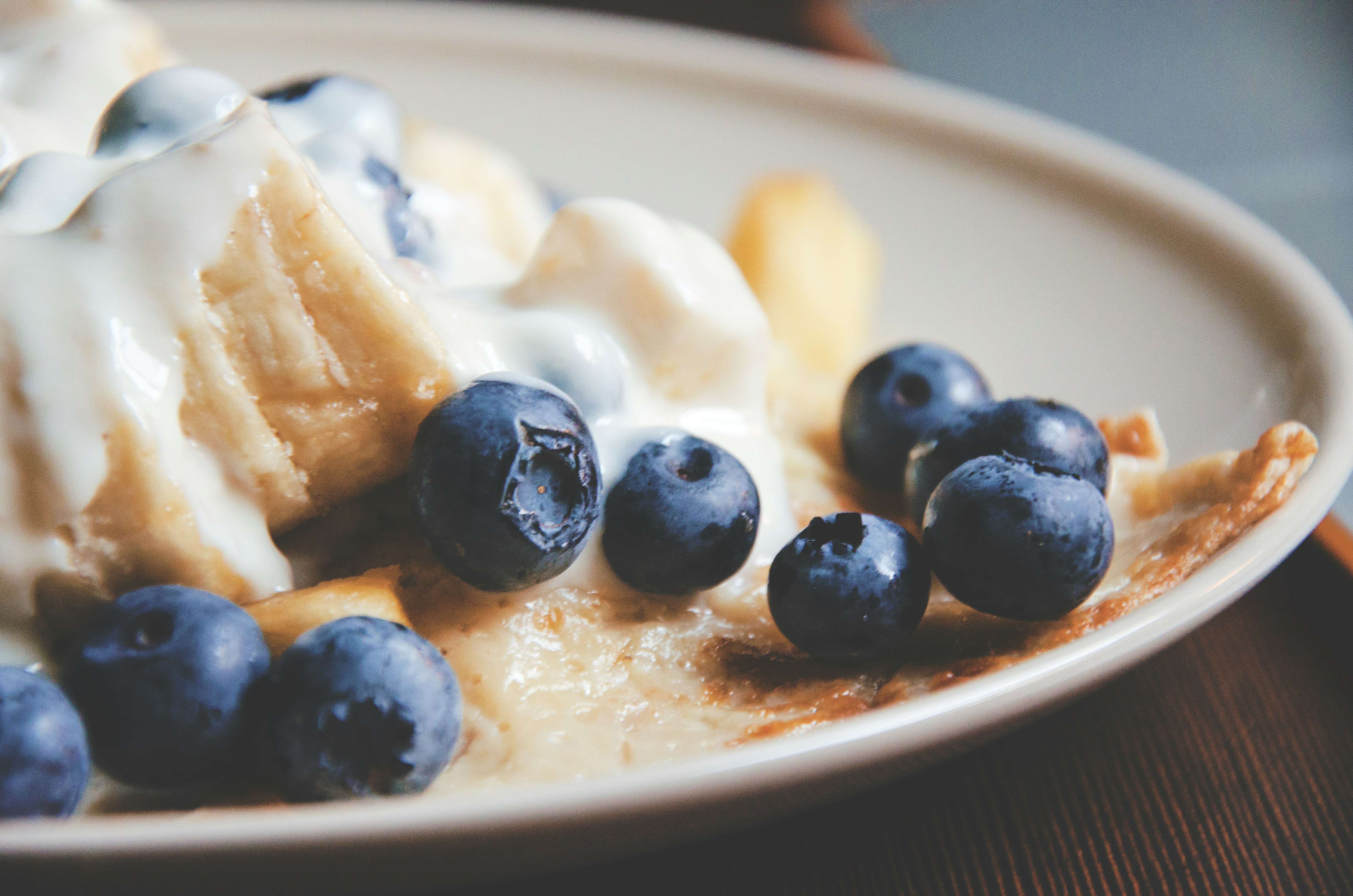 bowl of blue berries with cream