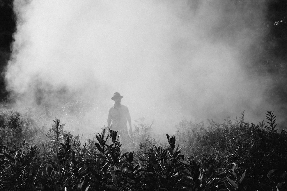 man standing in foggy area