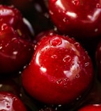 closeup photography of red cherry