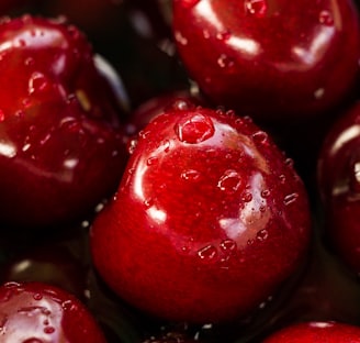 closeup photography of red cherry