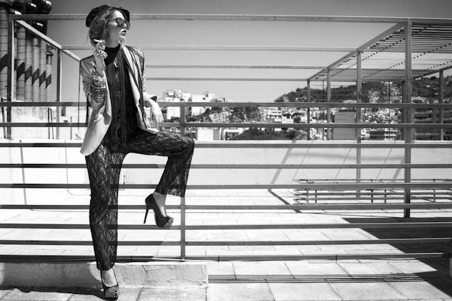 A sleek, modern outfit from Lumina Apparel displayed on a city rooftop at sunset.