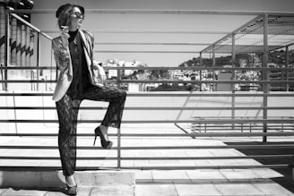 Model showcasing a sleek, modern luxury outfit on a city rooftop