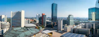 A panoramic view of a vibrant urban area with innovative buildings.