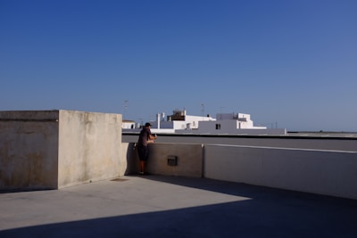 A quiet moment of reflection by a pilgrim gazing at the holy city from a rooftop.