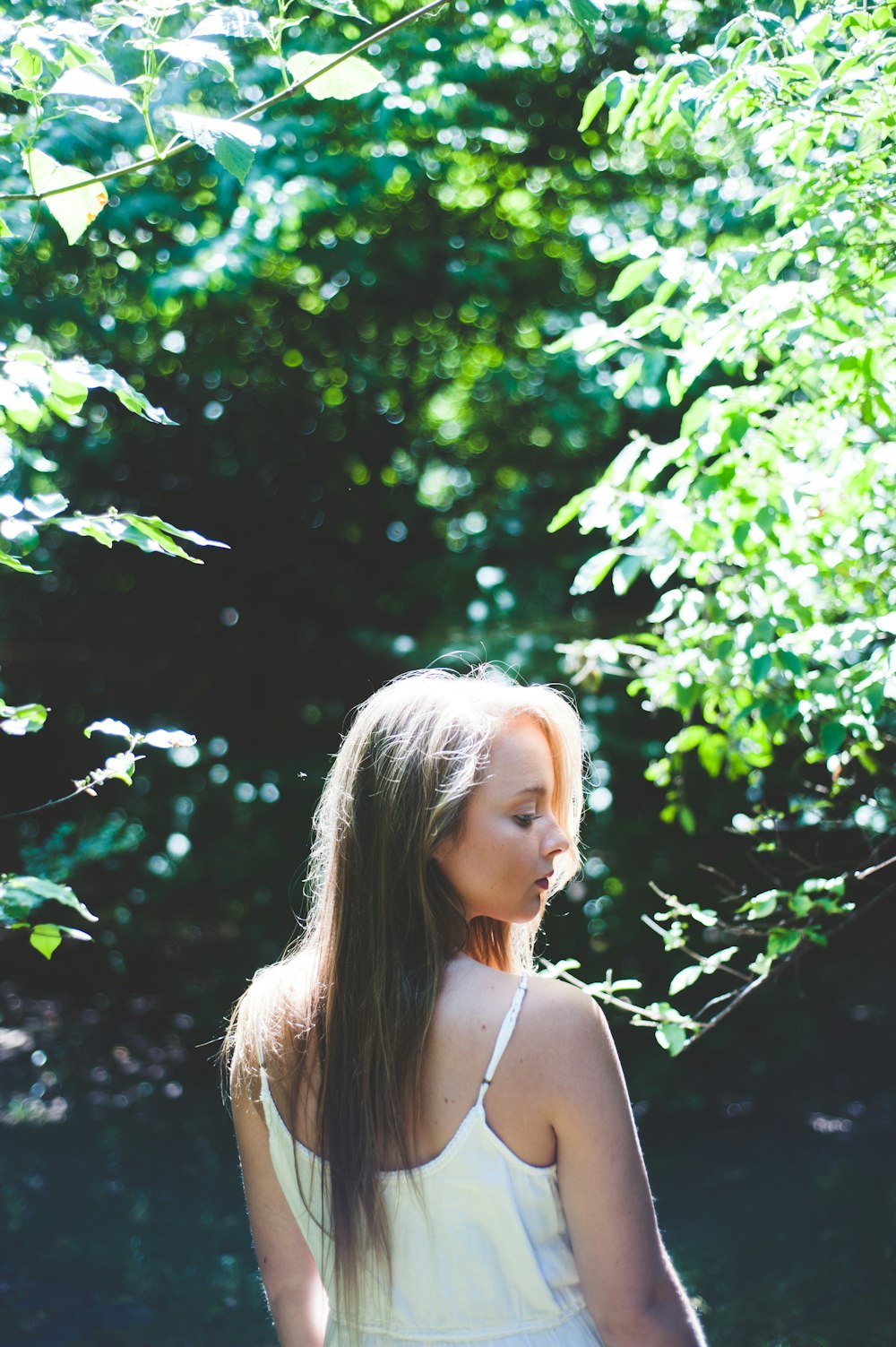 woman standing near tree during daytime