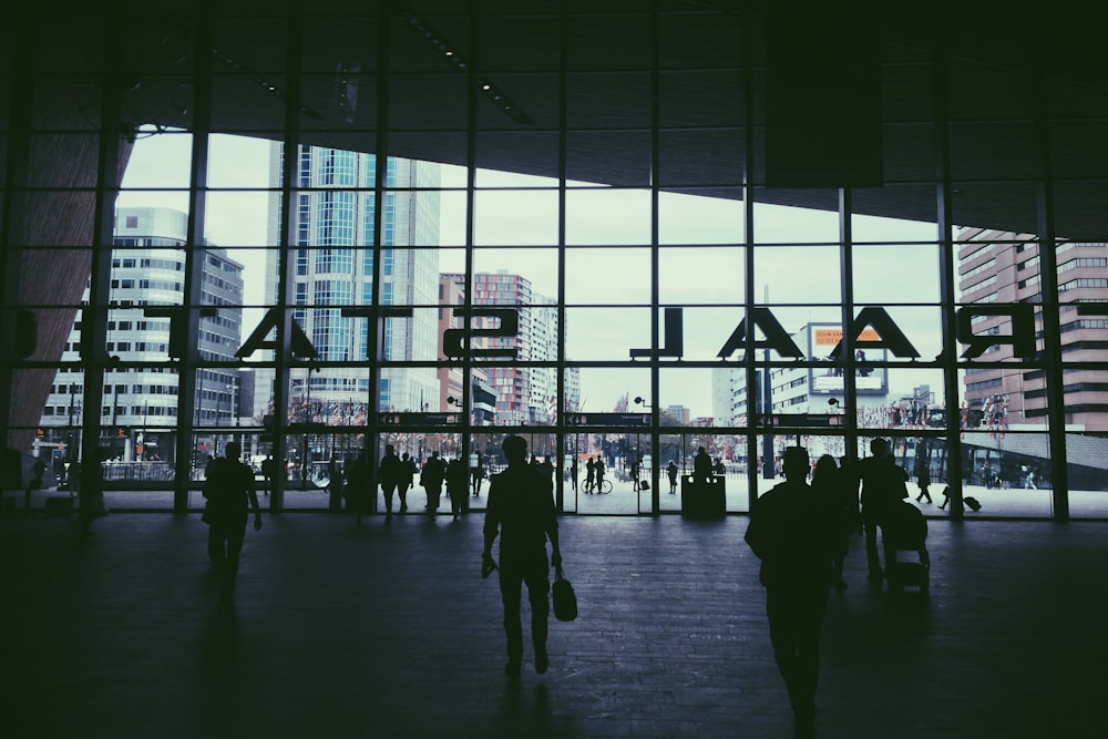 silhouette of people walking inside Raal Stat building