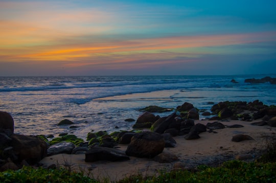 stones near shore during daytime in Kovalam India