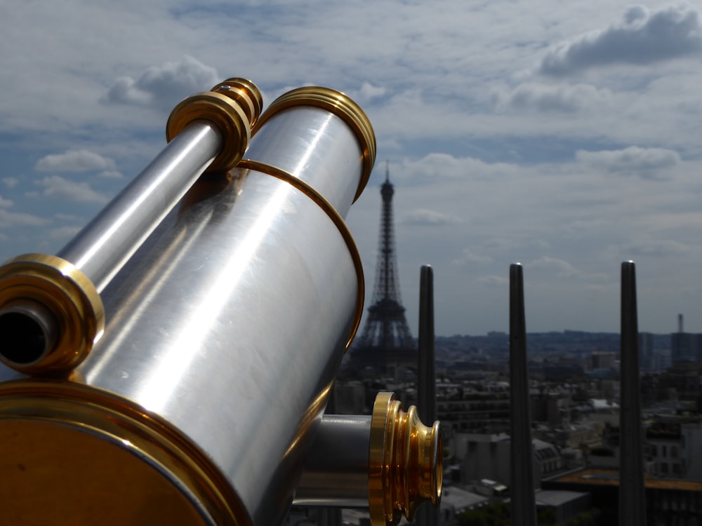 focus photography of telescope on Eiffel Tower, Paris