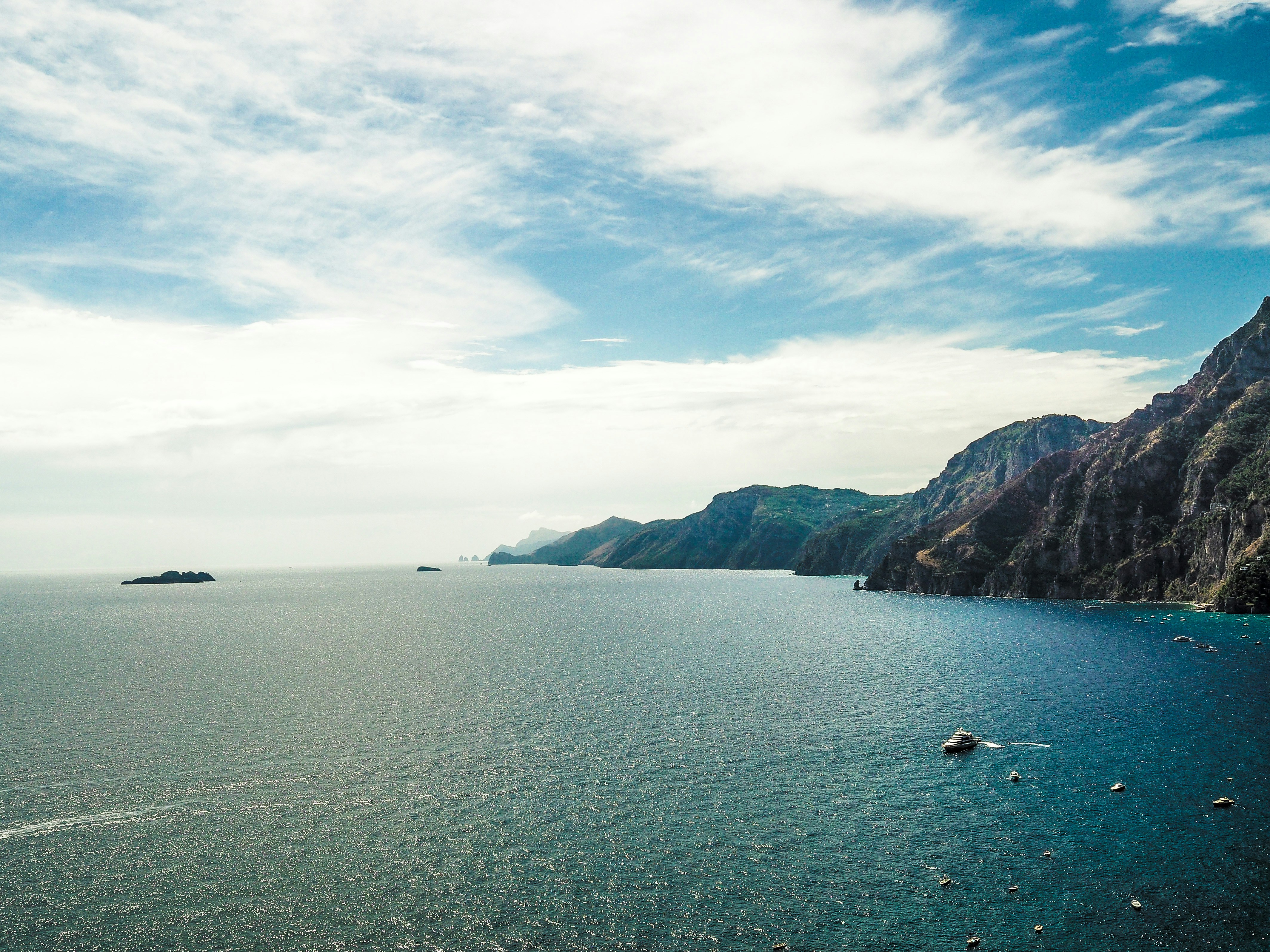 blue body of water amalfi coast zoom background