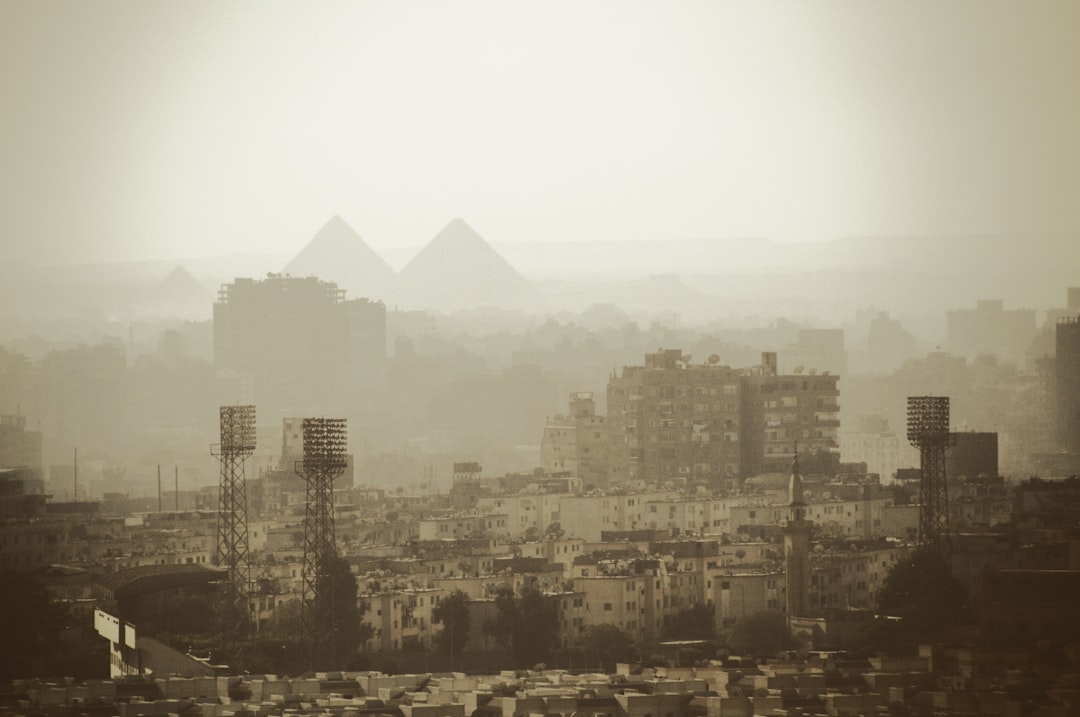 aerial photo of gray buildings near pyramids