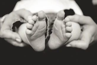 Close-up of a baby's first steps captured in a joyful moment.