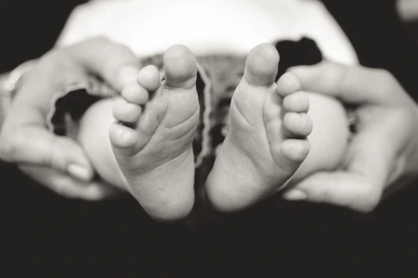 Close-up of a baby's first steps captured in a joyful moment.