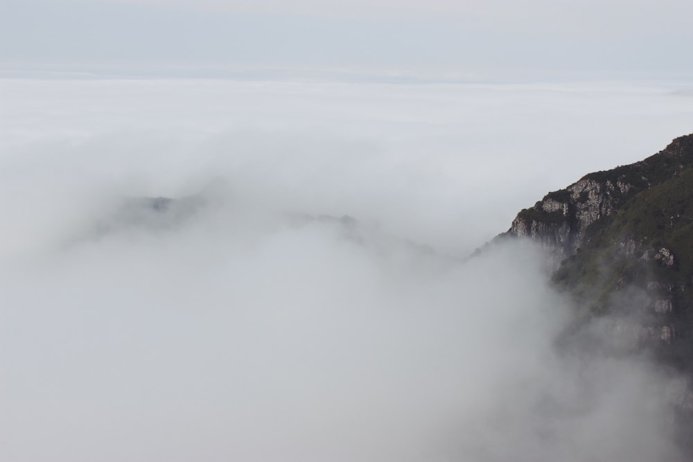 white cloud beside mountain