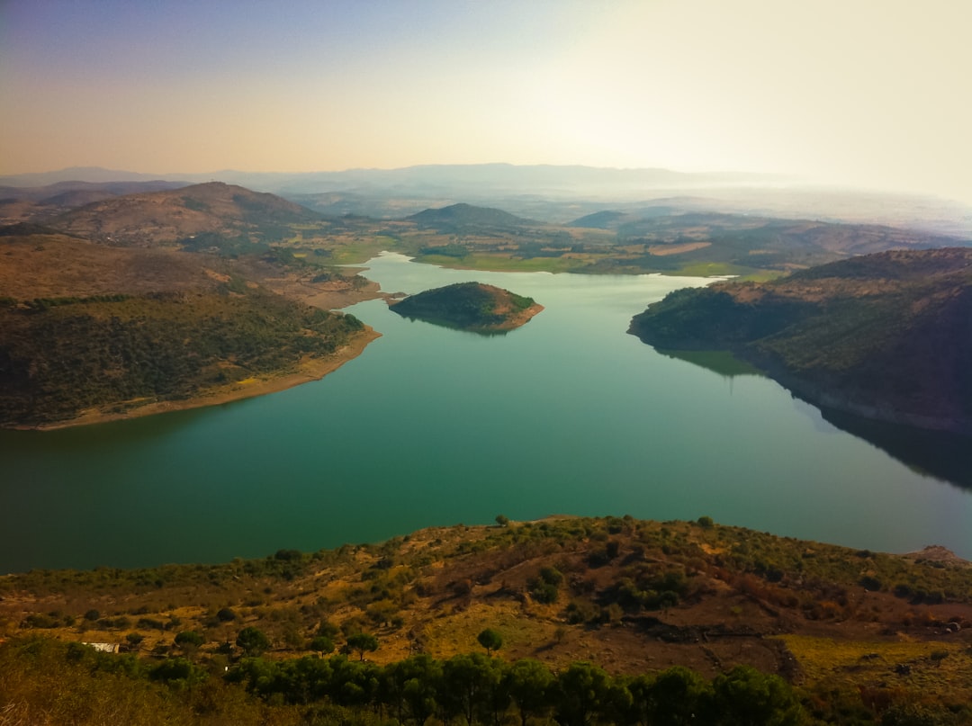 lake between hills,