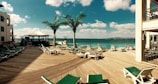green loungers on dock at daytime